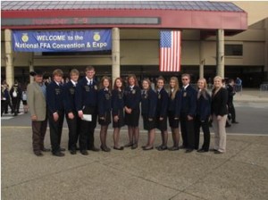 Tara Gildden poses for a picture with her FFA students.