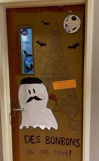 photo of door decorated with French ghost