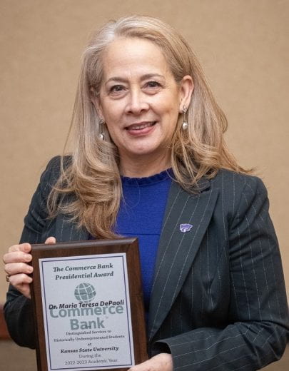 Photo of Dr. Maria DePaoli receiving Award