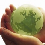 green globe in hands