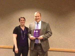 Dr. Amber Vennum with D. Scott Sibley, receiving the GTA of the Year award. 