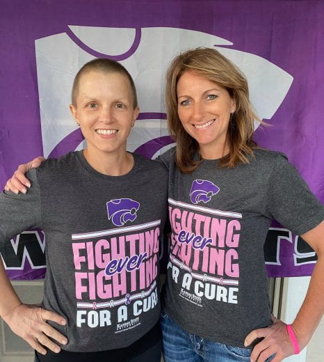 two supporters wearing the Fighting for a Cure shirt