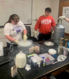 Caitlin Solis & Josh Barron making nitrogen ice cream at a Physics Club meeting